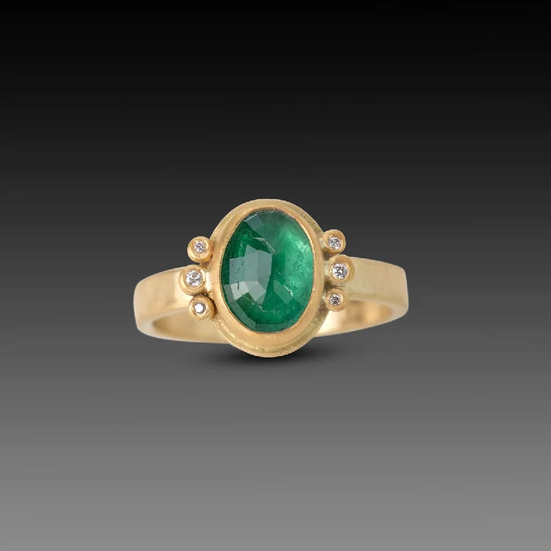 Delicate gemstone rings perfect for stacking adorned her fingers-Oval Emerald Ring With Diamond Trios