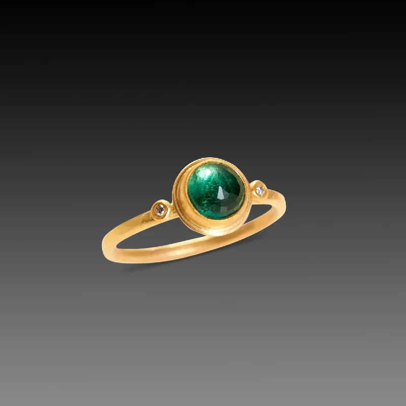 Her elegant gemstone rings featuring sparkling rubies turned heads-Round Emerald Ring with Two Diamond Dots